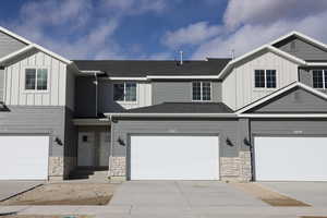 View of front facade featuring a garage