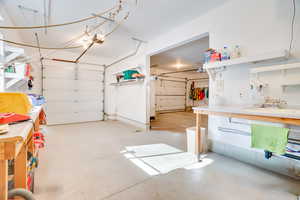 Garage with a garage door opener and sink