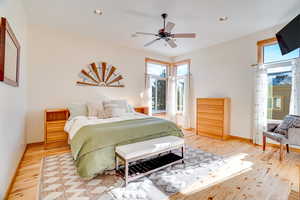 Bedroom featuring ceiling fan and light hardwood / wood-style flooring