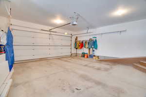 Garage featuring a garage door opener