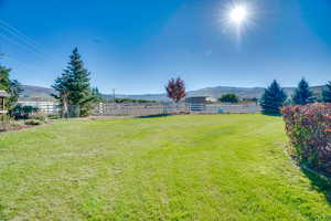 View of yard with a mountain view and a rural view