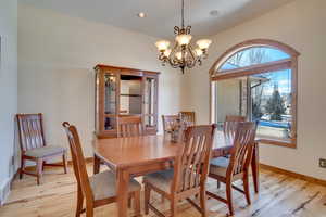 Dining room featuring light hardwood / wood-style floors and a chandelier