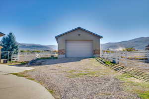 Garage featuring a mountain view and a rural view