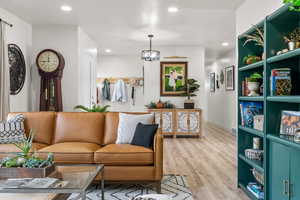 Living room with light hardwood / wood-style floors