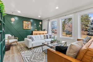 Living room with light hardwood / wood-style flooring