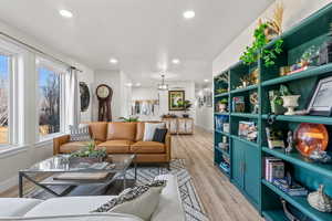 Living room with light wood-type flooring