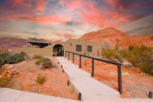 Southwest-style home with stucco siding and a mountain view