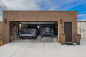 Garage featuring driveway