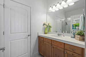 Bathroom with vanity and walk in shower