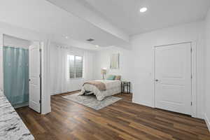 Bedroom featuring dark wood-type flooring