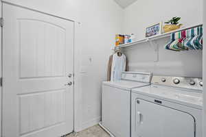 Laundry room featuring washing machine and clothes dryer