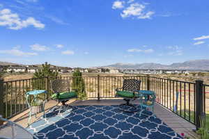 Wooden deck featuring a mountain view