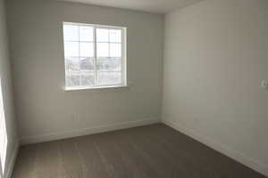 Spare room with carpet flooring and baseboards