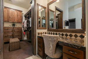 Bathroom with decorative backsplash and vanity