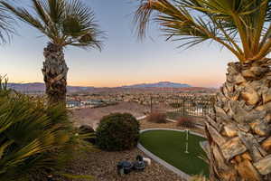 View of yard featuring fence and a mountain view