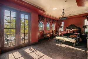 Bedroom with french doors, visible vents, access to outside, and carpet floors