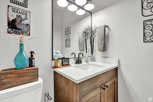 Bathroom featuring vanity and toilet