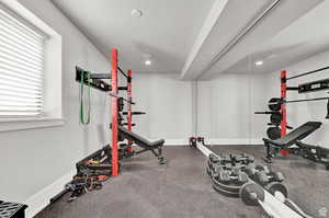 Exercise room featuring baseboards and recessed lighting