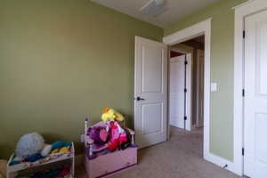 Recreation room featuring light carpet