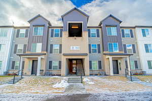 Multi unit property featuring central AC unit and brick siding