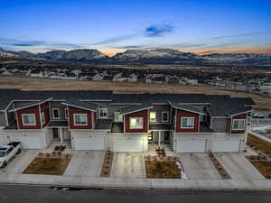 Townhome / multi-family property featuring a mountain view