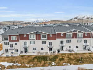 Birds eye view of property with a mountain view