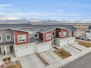 Townhome / multi-family property featuring a garage and a mountain view