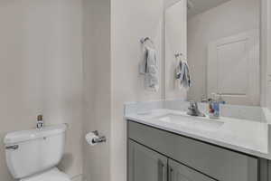 Bathroom featuring toilet and vanity