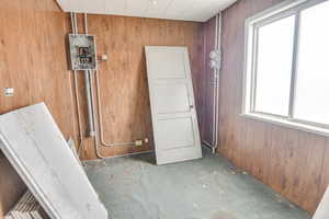 Interior space with concrete floors and wood walls