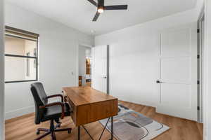 Bedroom #2 featuring light wood-style flooring, baseboards, and ceiling fan