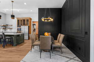 Dining space featuring light wood-style flooring and recessed lighting