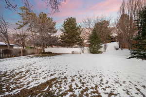 View of yard layered in snow