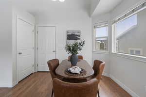 Dining space featuring hardwood / wood-style flooring