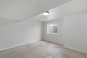 Unfurnished room featuring a textured ceiling