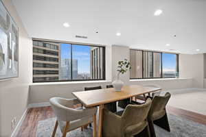 Dining area with hardwood / wood-style flooring