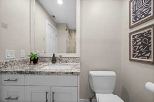 Bathroom featuring toilet and vanity