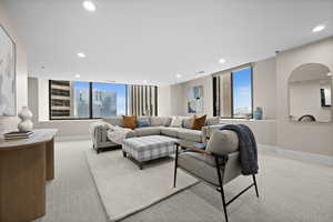 Carpeted living room with a wealth of natural light