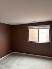 Unfurnished room featuring carpet floors