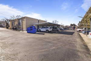 Partially covered parking lot with a residential view