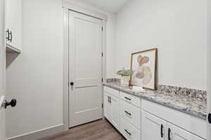 Bathroom featuring vanity and hardwood / wood-style floors