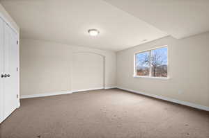 Unfurnished room with carpet