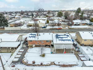 Snowy aerial view featuring a residential view