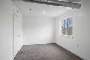 Empty room featuring carpet flooring