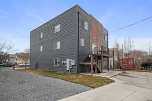 View of home's exterior featuring a wooden deck