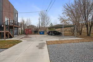 View of vehicle parking featuring a carport