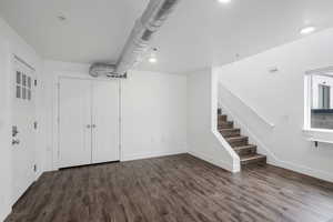 Interior space featuring dark wood-type flooring