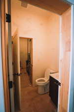 Bathroom and utility closet located in the garage.