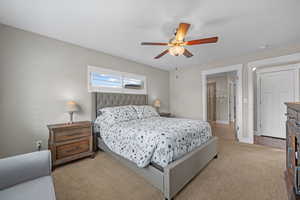 Bedroom featuring carpet and ceiling fan
