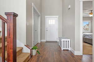 Foyer featuring dark hardwood / wood-style floors and ceiling fan