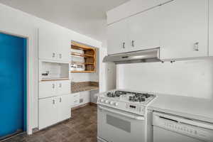 Kitchen with white appliances and white cabinets